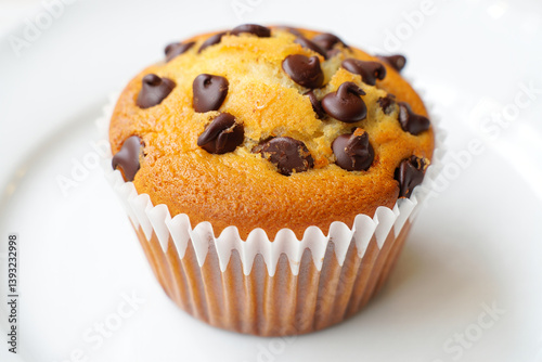 Perfectly Baked Muffin with Chocolate Chips in White Paper Cup