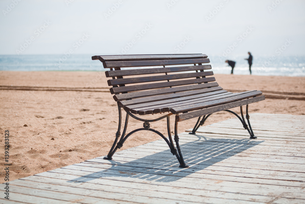 wooden bench on the background of the sea on the shore of the sea beach wooden bench on the background of the sea on the shore of the sea beach