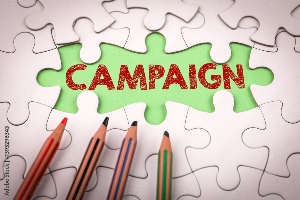 Campaign Concept. White puzzle pieces and colored pencils Campaign Concept. White puzzle pieces and colored pencils