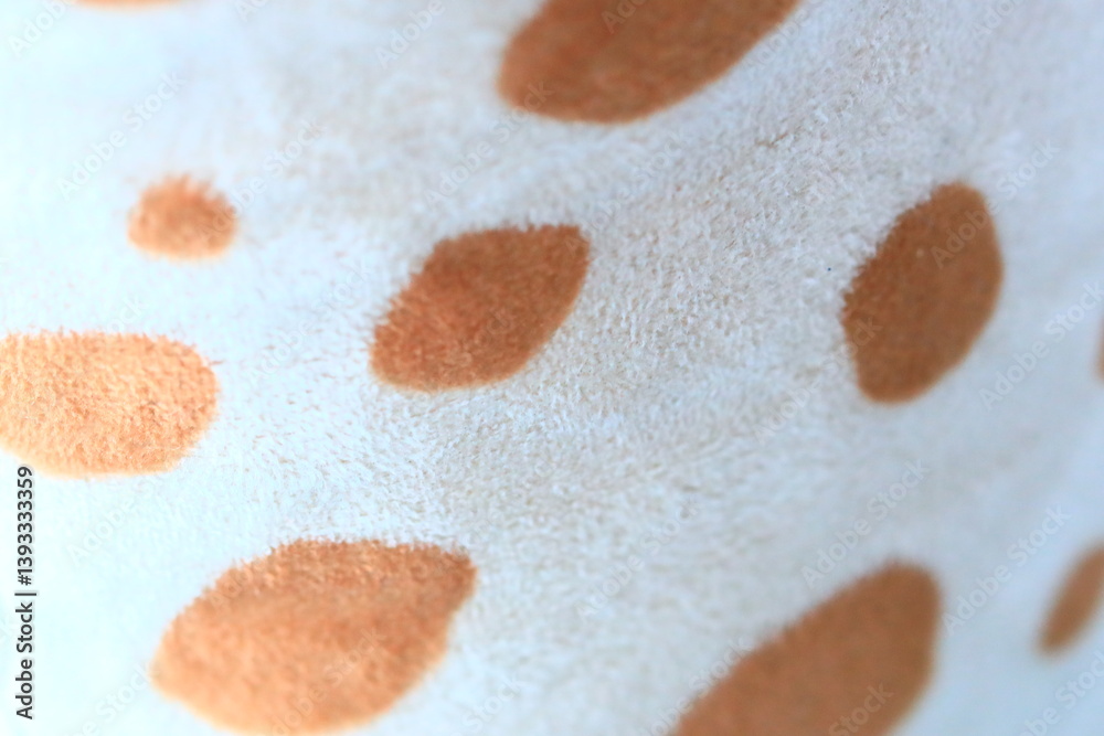 High-quality close-up of polka dot print fabric, perfect for textile or design projects