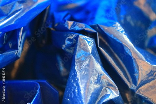 Obraz na płótnie A close-up view of a blue plastic bag with creases and folds. w salonie