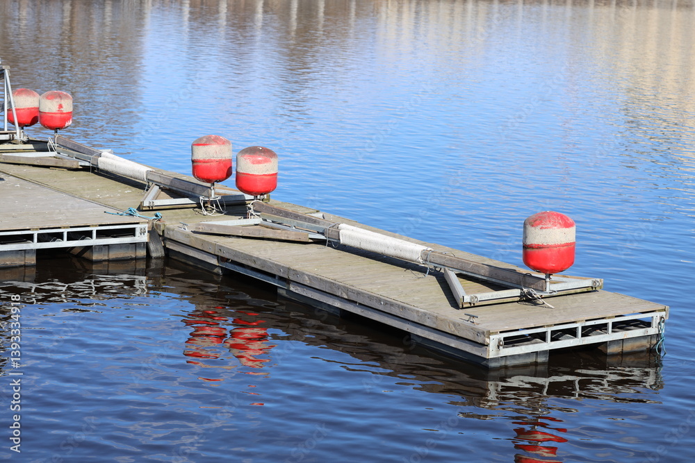 A dock with floating buoys, perfect for water sports or fishing.
