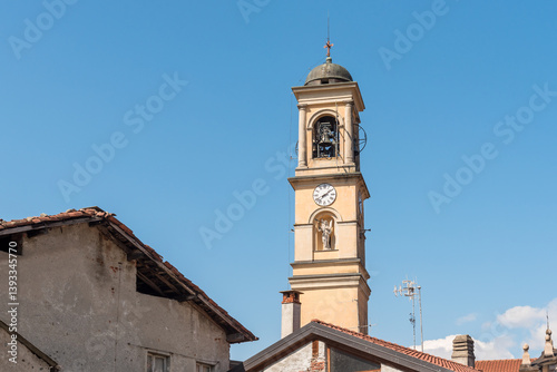 The bell tower of the parish church of Saints John the Baptist and Roch of Germignaga, in the province of Varese, Lombardy, Italy.