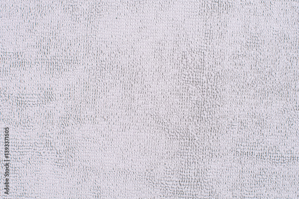 Grey microfiber cloth with intricate textured loop weave that creates a soft fabric texture, ideal for wiping away dust and dirt when cleaning your home,