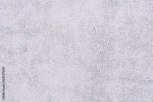 Grey microfiber cloth with intricate textured loop weave that creates a soft fabric texture, ideal for wiping away dust and dirt when cleaning your home,