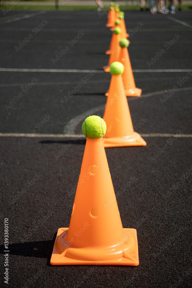 Sports ground. Playground equipment. Orange cone.