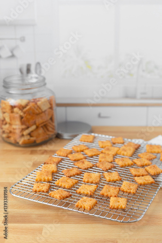 Homemade Cheese Crackers on Cooling Rack on Butcher Block Kitchen Countertop