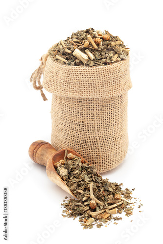 Close-up of Dry Organic Ashwagandha (Withania somnifera) leaves, in a jute bag and on a scoop, Isolated on a white background. photo