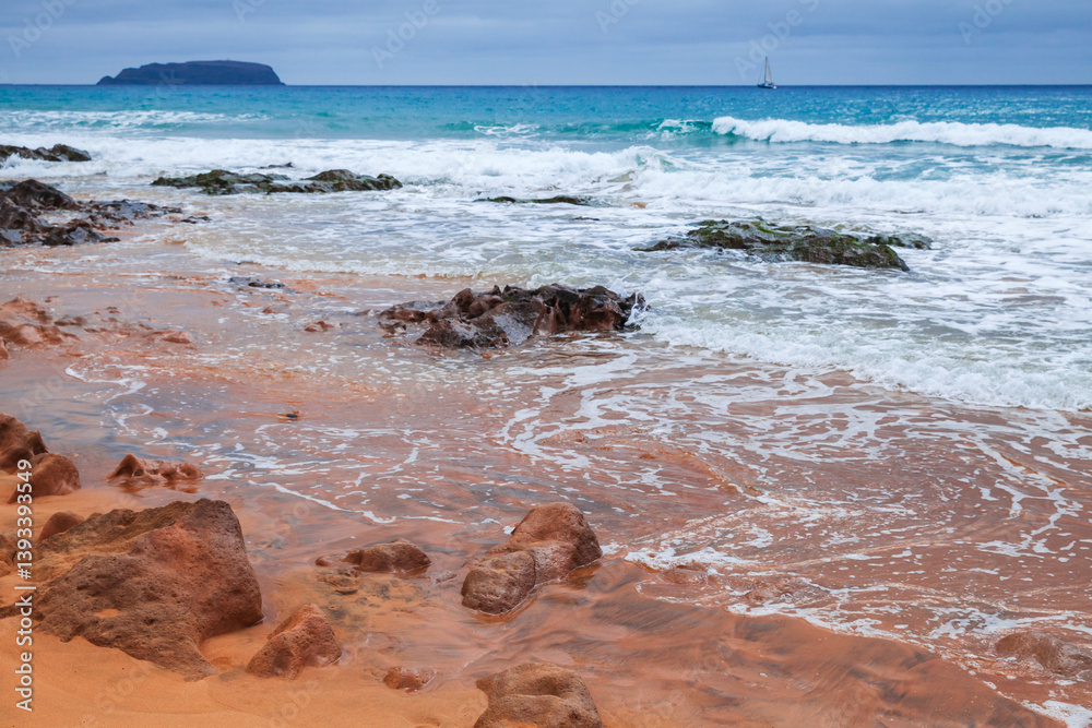 Landscape of Porto Santo, Portugal. A serene coastal scene with red rocks