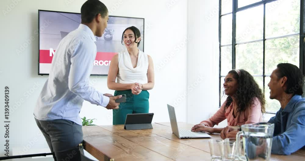Happy diverse colleagues having meeting, discussing work and clapping hands in office Happy diverse colleagues having meeting, discussing work and clapping hands in office