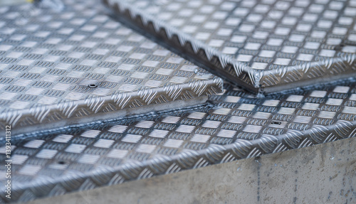 Obraz na płótnie overlapping metal plates with checkered texture. w salonie