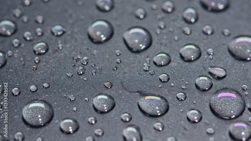 Obraz na płótnie A close-up shot of water droplets on a surface, great for use in scientific or educational contexts w salonie