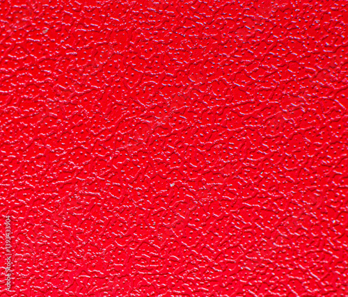 red texture surface, shapeless spots and drops