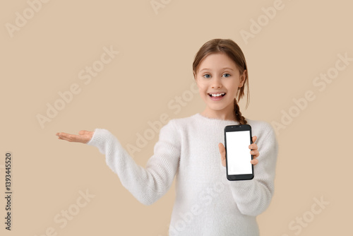 Little girl with mobile pho...