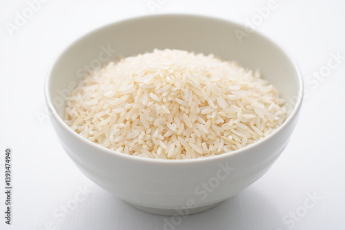 Uncooked White Rice in Plain White Bowl on White Background