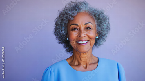 An elegant senior woman exudes a captivating aura of wisdom and joy, her warm smile and stylish gray curls set against a vivid backdrop.