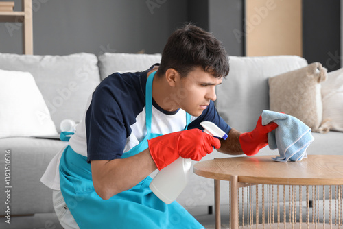 Young man cleaning coffee t...