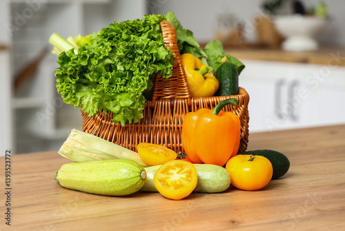 Obraz na płótnie Wicker basket with different fresh vegetables on wooden kitchen counter w salonie