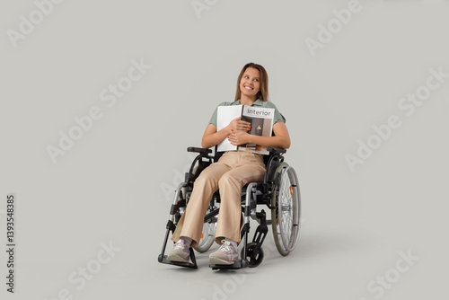 Young woman in wheelchair w...