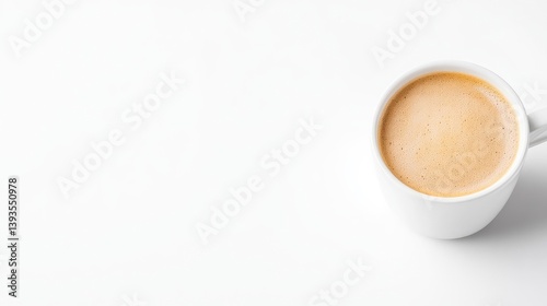A white ceramic cup of frothy latte on a clean white surface, minimalist composition, side view, natural light, and coffee break concept.