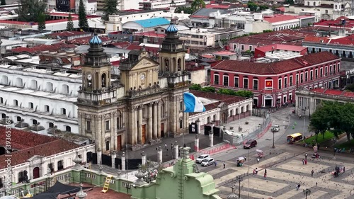 Beautiful cinematic footage of the Metropolitan Cathedral of Santiago de Guatemala, the National Palace of Culture, and the Waving flag of Guatemala