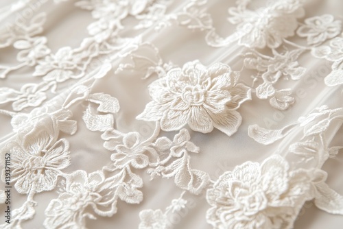 Close-up of delicate white Alenon lace fabric with floral embroidery, showcasing intricate patterns and textures.