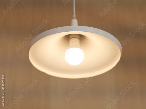 Luxury Hanging white lamp with bulb. Famous creative Light interior design in living room.