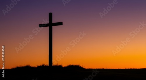 A wooden cross stands on a hill silhouetted against a dramatic sunset sky in shades of orange, purple, and red, symbolizing faith, hope, and spiritual reflection in nature.