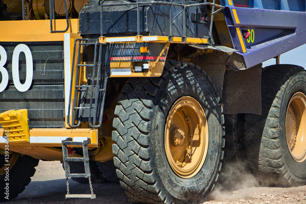 mining truck macro close on wheels driving on gravel road, open pit mine, large industrial operation to extract diamonds, mining truck macro close on wheels driving on gravel road, open pit mine, large industrial operation to extract diamonds,