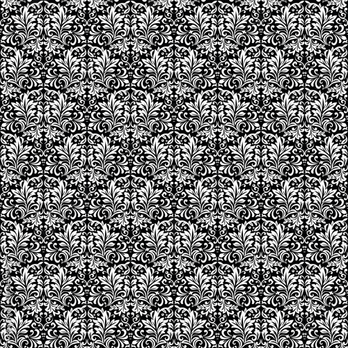 Wallpaper in the style of Baroque. Seamless vector background. White and black floral ornament. Graphic pattern for fabric, wallpaper, packaging. Ornate Damask flower ornament.
