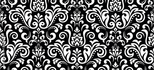 Wallpaper in the style of Baroque. Seamless vector background. White and black floral ornament. Graphic pattern for fabric, wallpaper, packaging. Ornate Damask flower ornament.