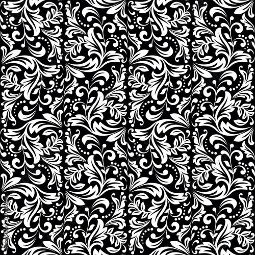 Wallpaper in the style of Baroque. Seamless vector background. White and black floral ornament. Graphic pattern for fabric, wallpaper, packaging. Ornate Damask flower ornament.