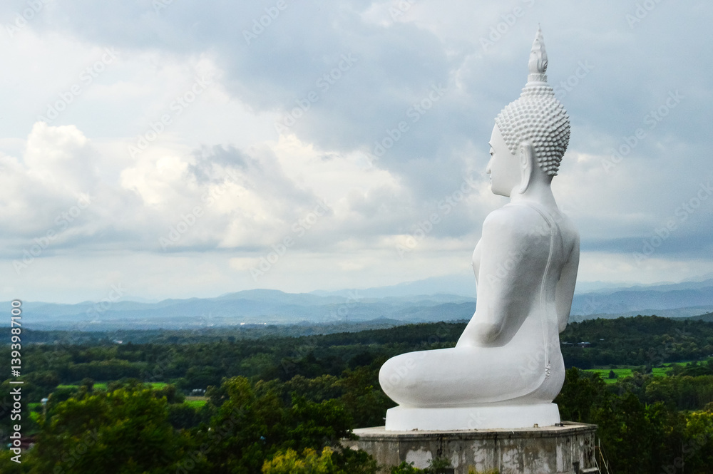 Big white Buddha statue Sculpture, architecture and symbols of Buddhism, South East Asia at Phrae Northern Thailand Big white Buddha statue Sculpture, architecture and symbols of Buddhism, South East Asia at Phrae Northern Thailand