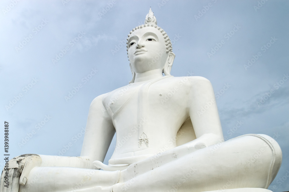 Big white Buddha statue Sculpture, architecture and symbols of Buddhism, South East Asia at Phrae Northern Thailand Big white Buddha statue Sculpture, architecture and symbols of Buddhism, South East Asia at Phrae Northern Thailand