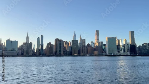Horizontal video of the midtown Manhattan skyline during daytime across from the East River.