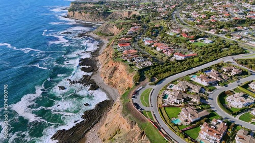 Aerial photo of luxury coastal homes along the scenic cliffs of Rancho Palos Verdes, California. The image captures elegant residential properties overlooking the Pacific Ocean in Los Angeles County.