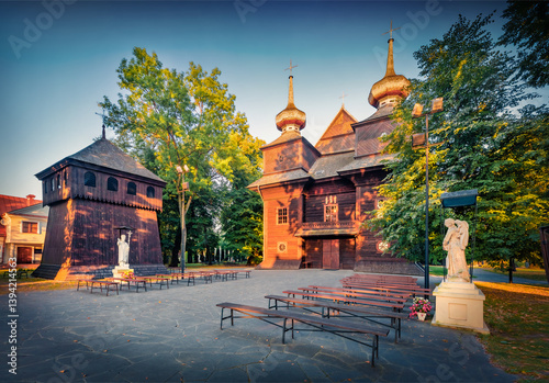 Obraz na płótnie Adorable morning view of wooden Catholic Church of the Annunciation of the Blessed Virgin Mary. Exciting summser cityscape of Tomaszow Lubelski town, Poland. Traveling concept background. w salonie