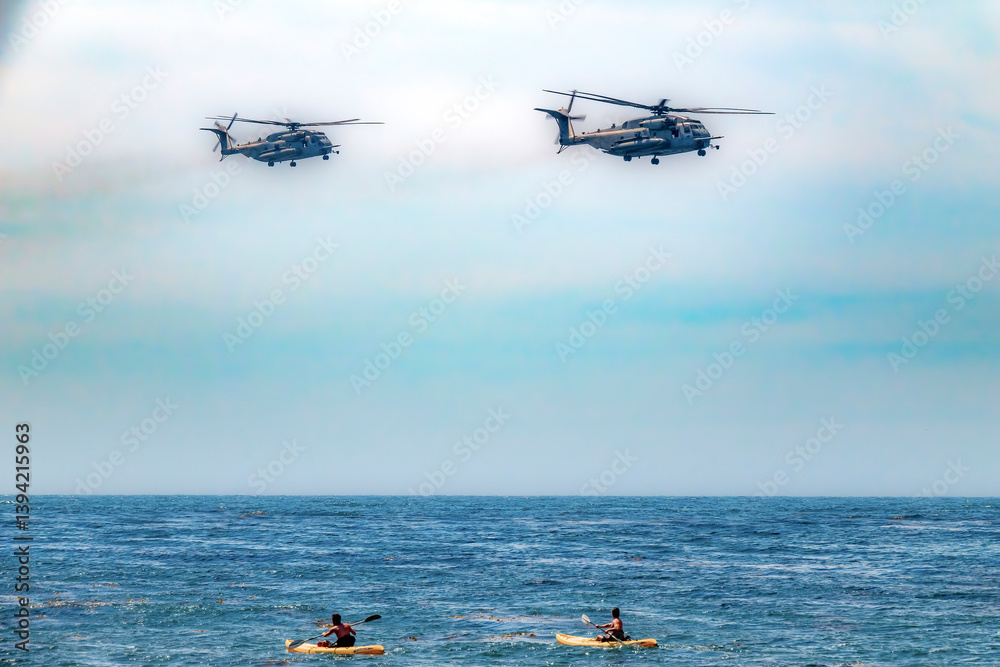 Two helicopters fly over kayakers, startling them into quickly looking up