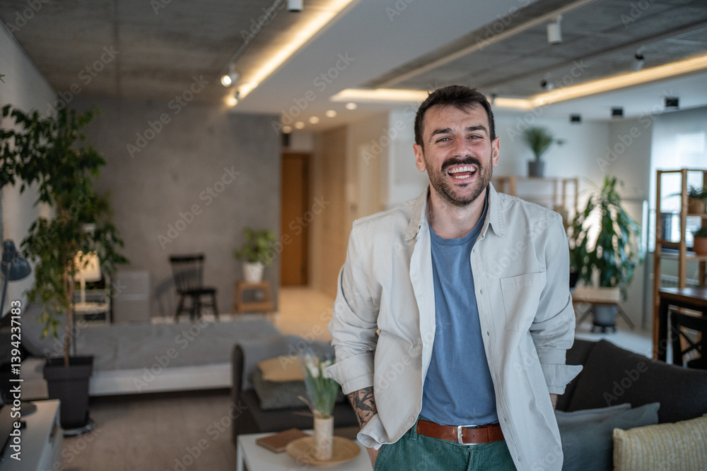 Happy designer smiling in modern industrial style apartment Happy designer smiling in modern industrial style apartment