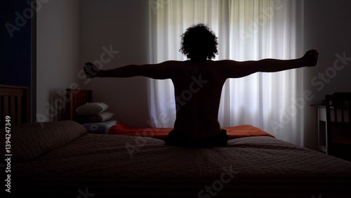 Obraz na płótnie Man wakes up in the morning and gets out of bed to open the window curtains and look out of the house ready to start a new day - lifestyle in apartment w salonie