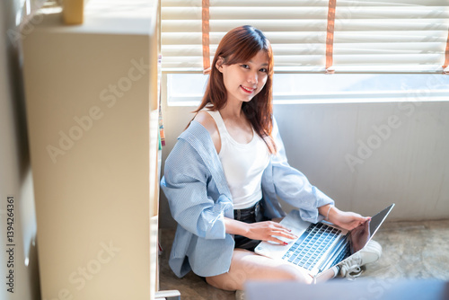Obraz na płótnie Portrait of asian freelance teenage people business woman casual working with laptop computer in cafe interior in coffee shop background,business expressed confidence embolden and successful concept w salonie