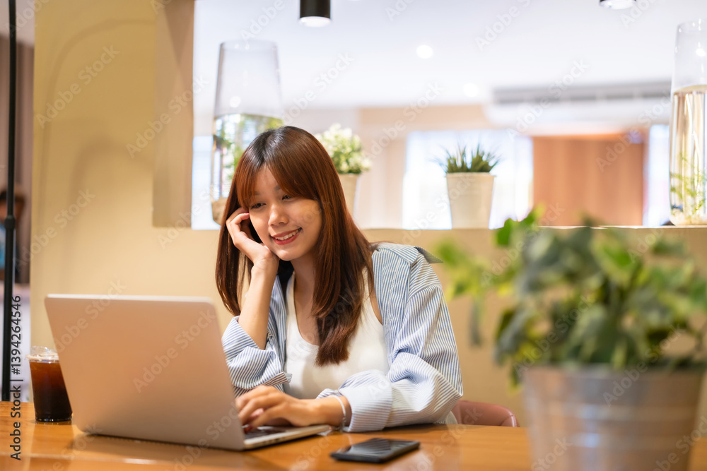 Portrait of asian freelance teenage people business woman casual working with laptop computer in cafe interior in coffee shop background,business expressed confidence embolden and successful concept
