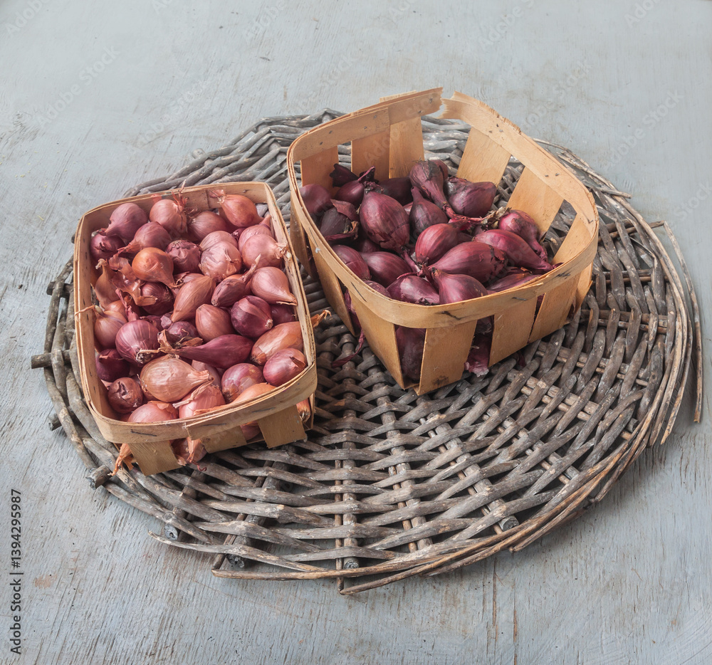 Two baskets with red onion sets of different varieties Two baskets with red onion sets of different varieties