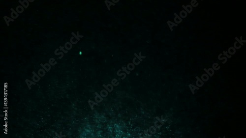Dark underwater scene with mysterious deep sea particles and subtle light
