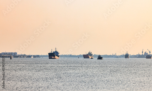 Panorama view of ocean liner, Cargo Ship, Thanker going to port in Thai gulf zone near Samutprakarn province, Thailand.