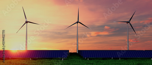 Three wind turbines are standing in a field with a sunset in the background