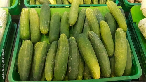 Billede på lærred Fresh Green Cucumbers at the Market