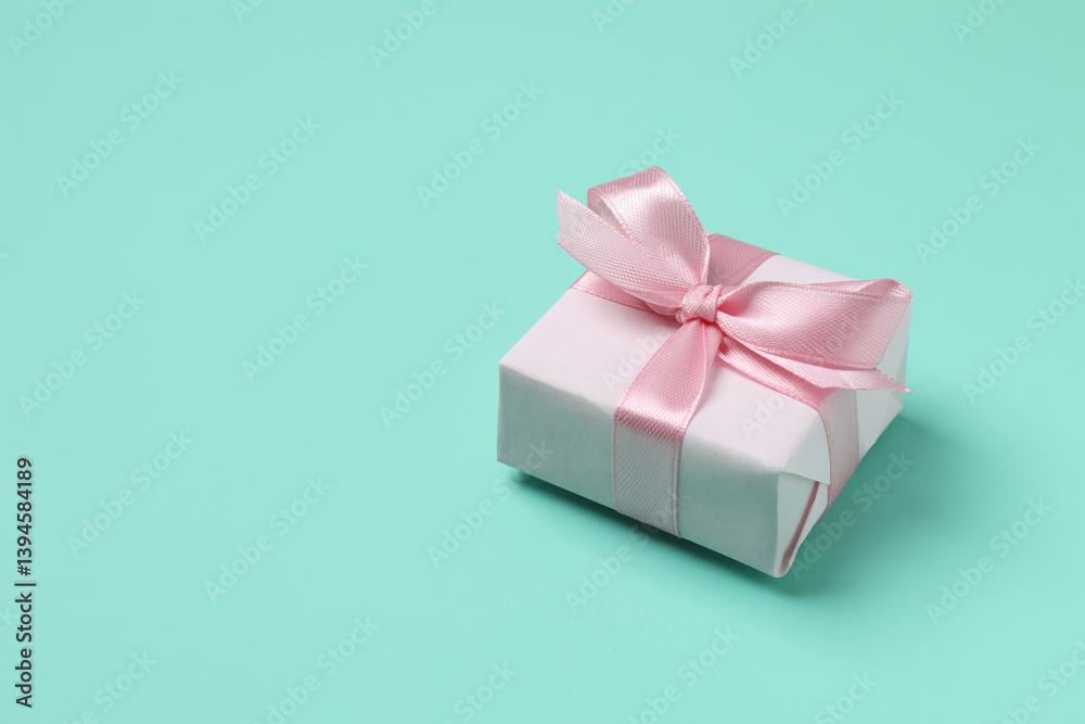 Fototapeta premium Beautiful gift box on color background