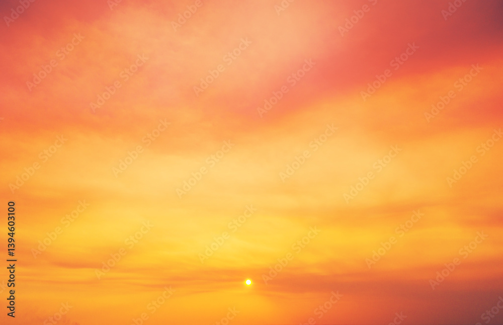 Orange cloudy sky at sunset. Orange and yellow gradient color. Sky texture, abstract nature background