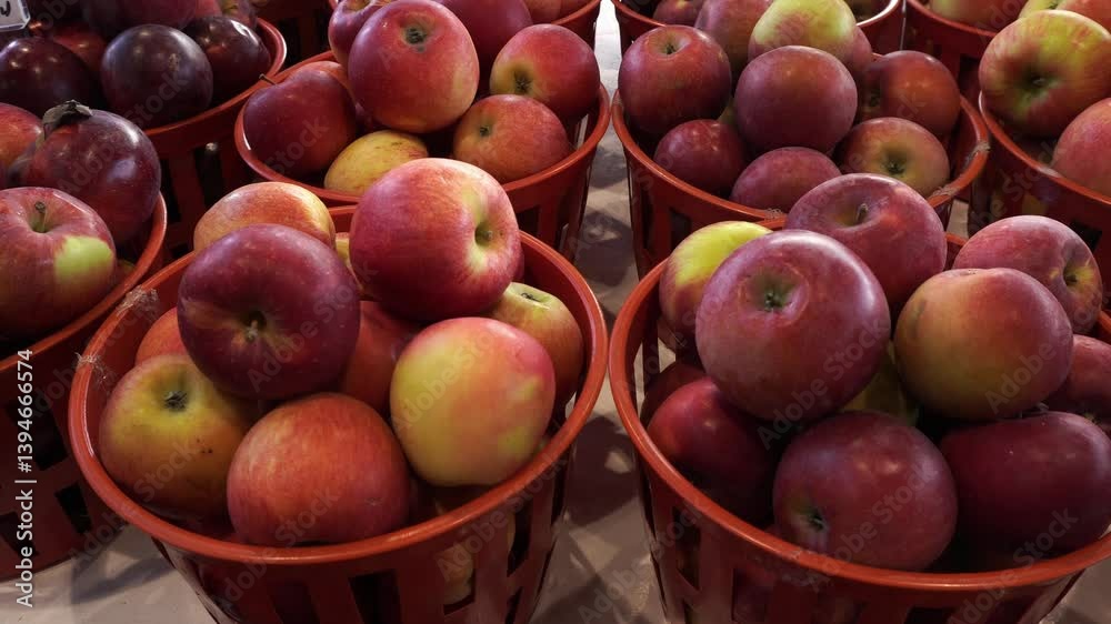 Wow, a beautiful presentation of apples in lovely circular red plastic containers. We can see a nice cinematic motion. Wow, a beautiful presentation of apples in lovely circular red plastic containers. We can see a nice cinematic motion.